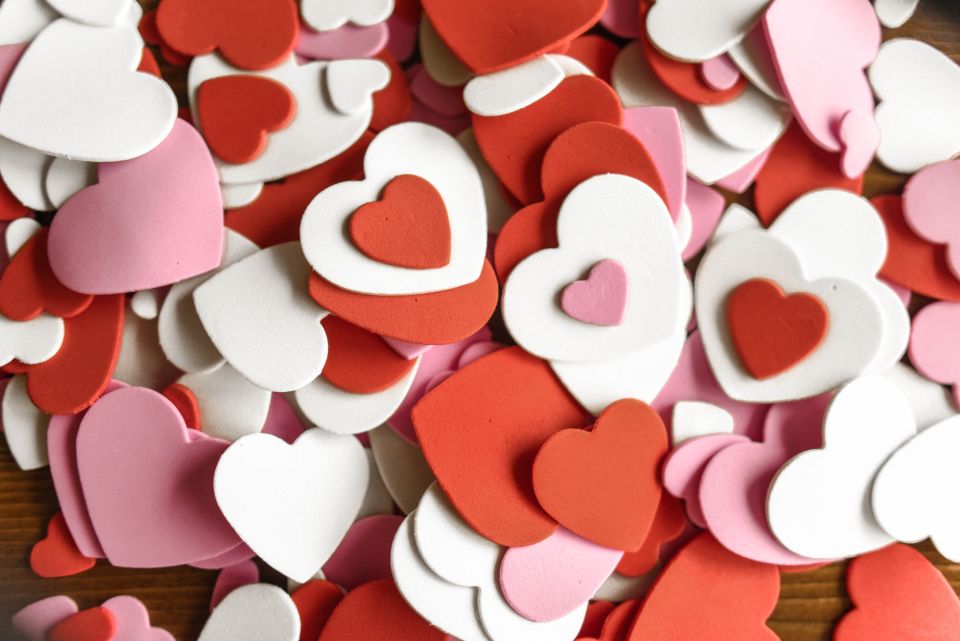 pile of pink, red, and white felt hearts in various sizes