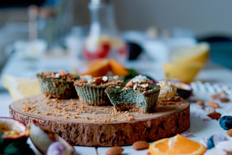 food photography, three muffins on wooden platter, kitchen countertop