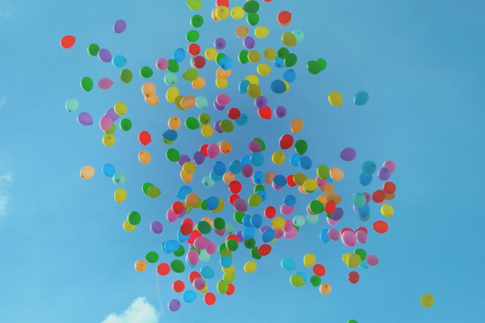 outdoor setting with balloons floating in the air